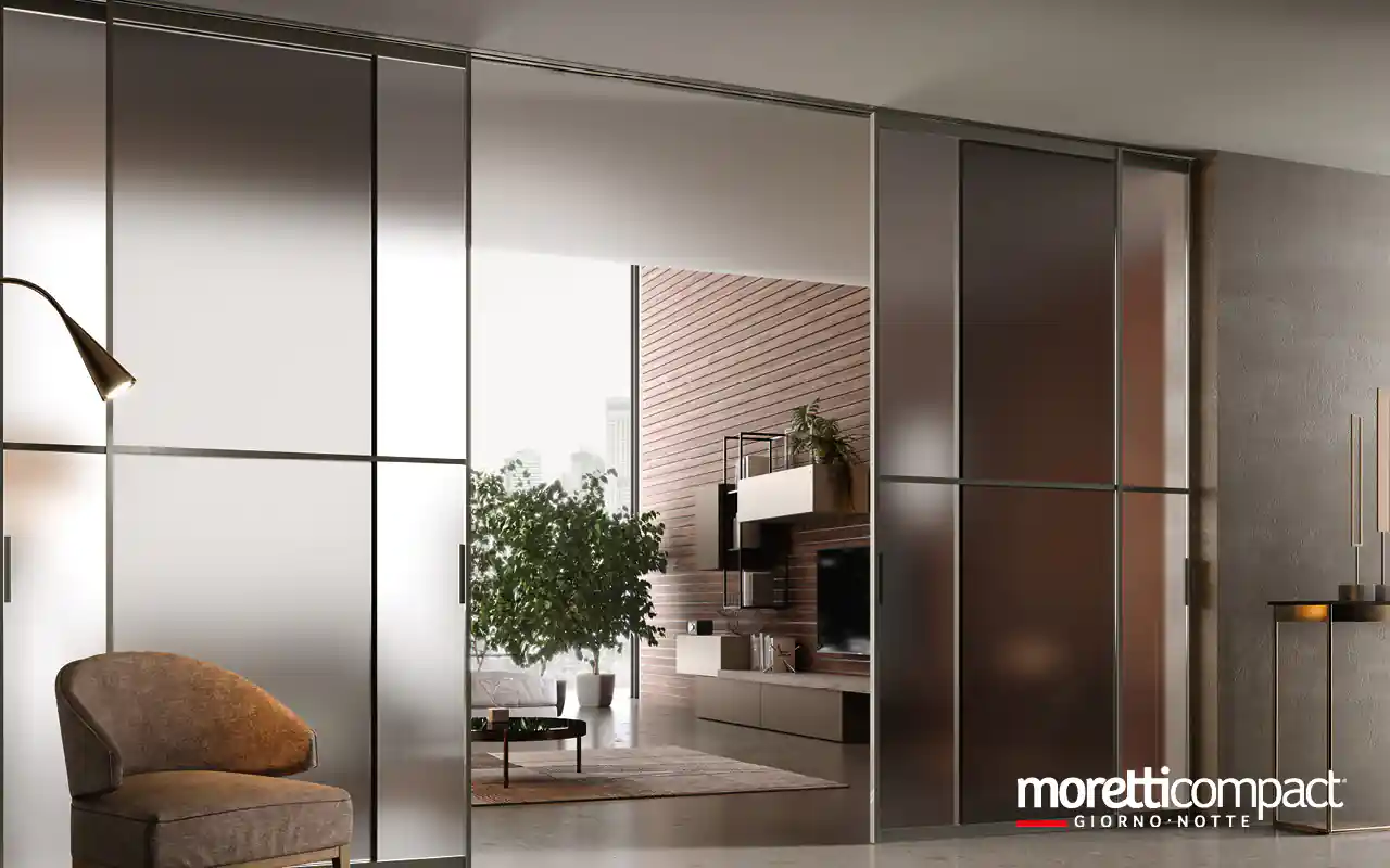 Portale ad ante scorrevoli con binario incassato a soffitto