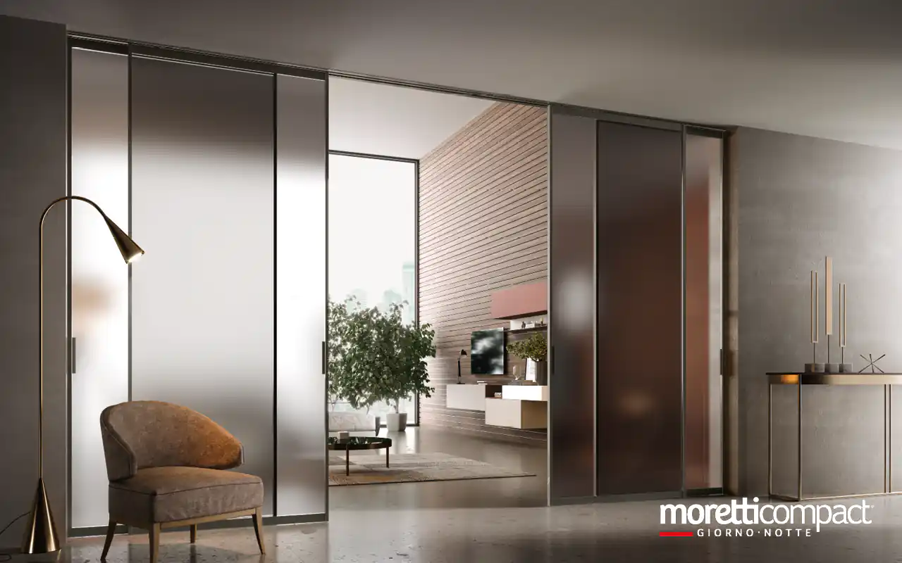 Portale ad ante scorrevoli con binario incassato a soffitto